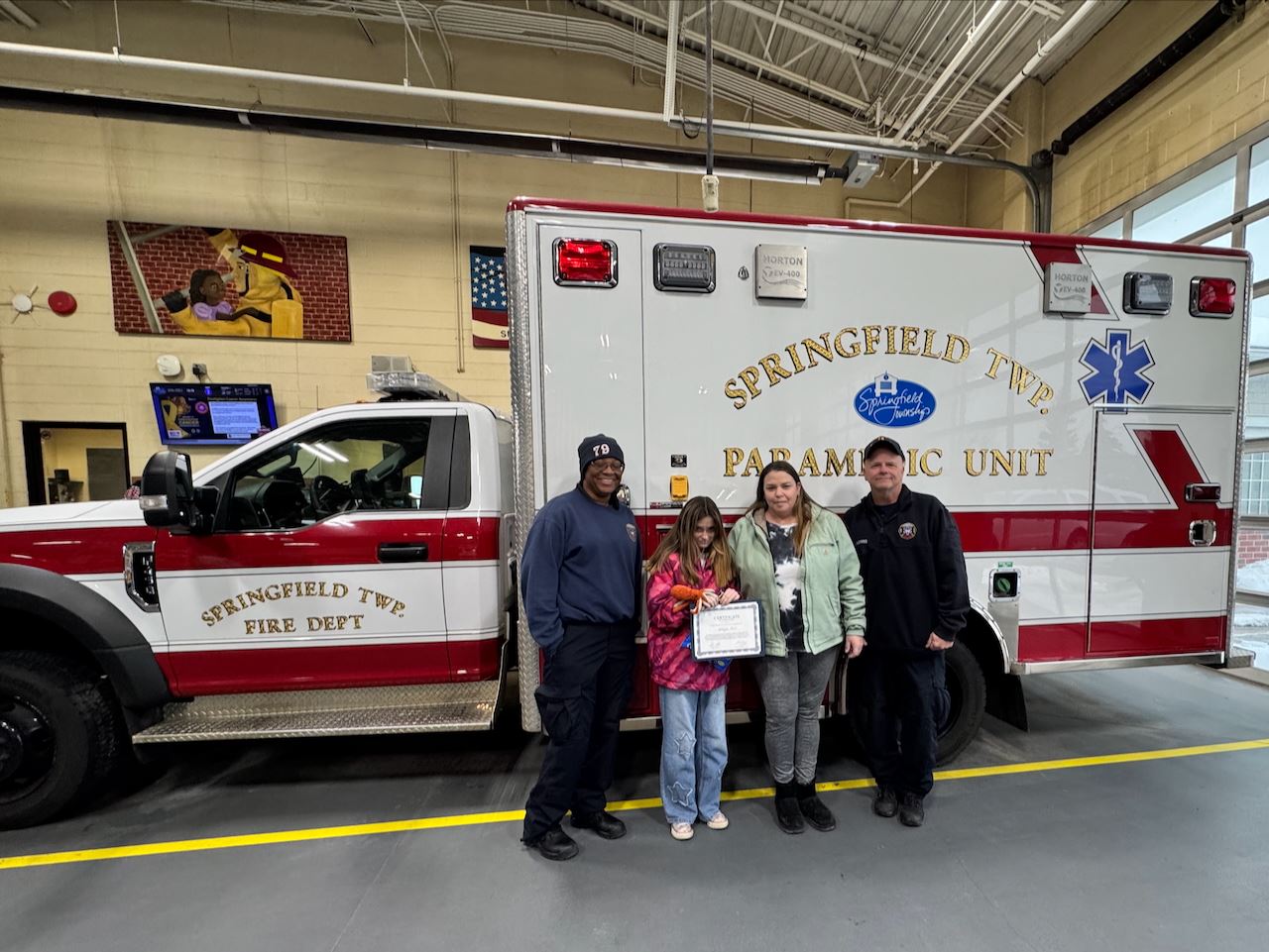 Mikayla, her mom, and Springfield Township EMS personnel